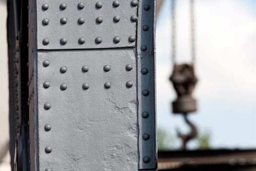 Solid crane steel with rivets and a crane hook