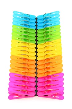 Colorful plastic clothespins on a white background