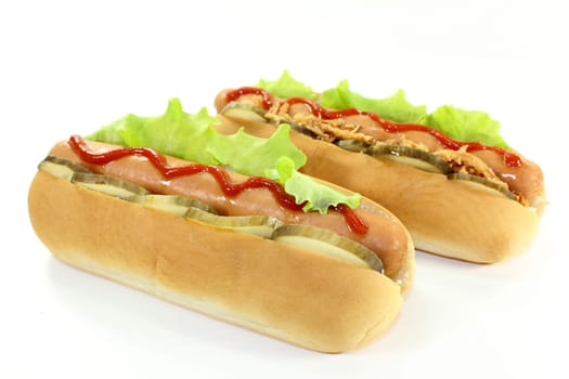 various hot dog's against a white background