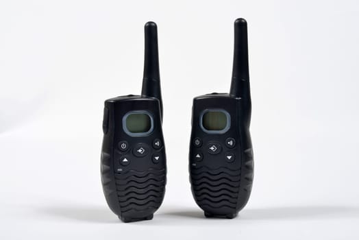 2 walkie talkie on a white surface.
