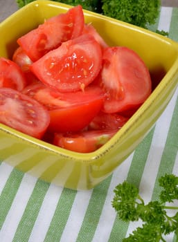 a tomato salad  on a green towel
