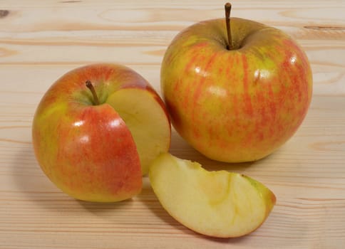 two apples with a piece cut