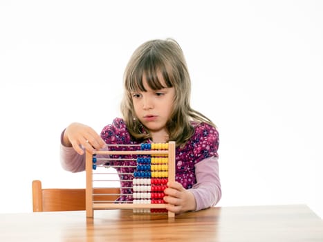 Child reckons with abacus