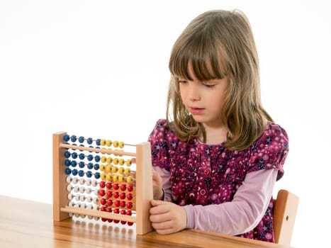 Child reckons with abacus