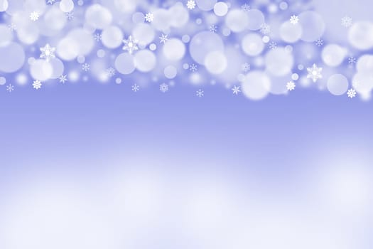 The white and grey blurred balls and snowflakes on a blue background. Balls are placed on the top of the picture. The background is downward lighter.