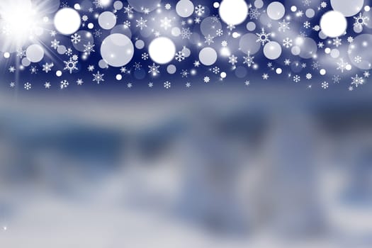 The winter blurred landscape and the white stars, lights and snowflakes on a dark blue sky in the upper part of the picture.