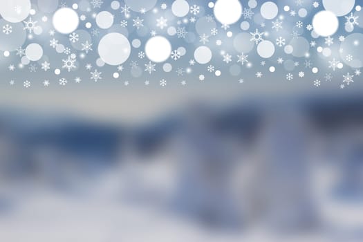 The blurred winter landscape and the white and grey blurred balls and snowflakes on the top of the picture.