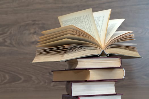 books on wooden deck tabletop