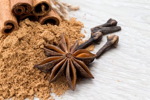 Cloves, anise and cinnamon isolated on white background