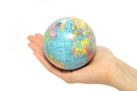 Hand holdings a globe on a white