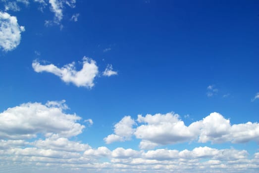 blue sky background with tiny clouds