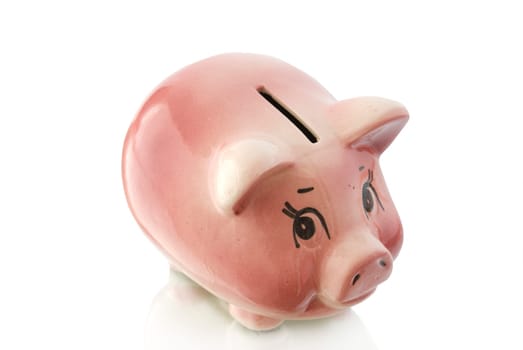 Pink piggy bank  isolated on white background with coins