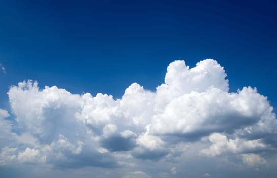 blue sky background with tiny clouds