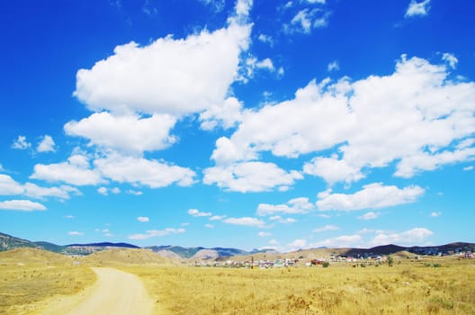 field on a background of the blue sky