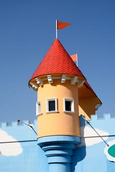 amusement park castle on the blue sky background