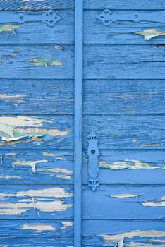 old wooden blue gate with metal handle