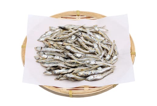 Dried small fish on bamboo basket