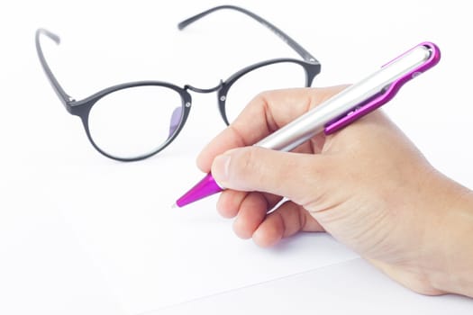Hands writing recipient address on white envelope, stock photo