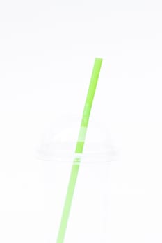 Empty plastic cup with straw isolated on white background, stock photo