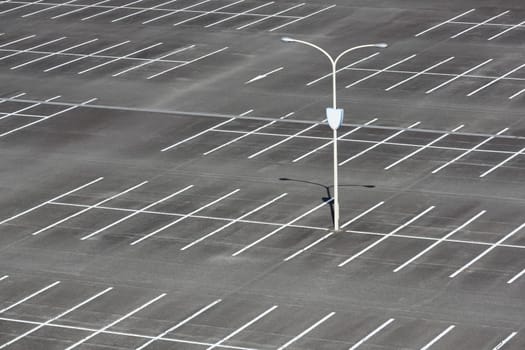 Empty car parking lot with light pole