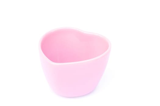 Pink ceramic bowl isolated on white background, stock photo