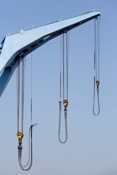 Crane boom against a clear blue sky