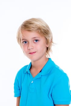 smiling blond boy in front of white background