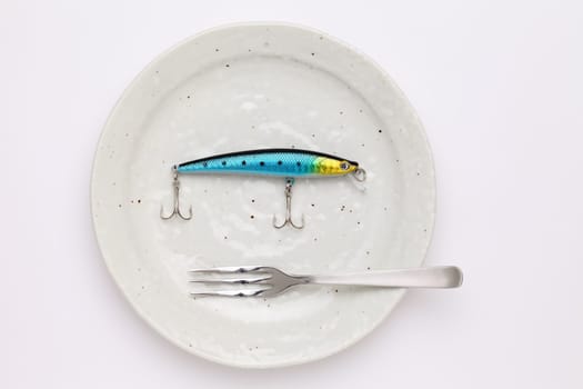 plastic fishing lure on plate