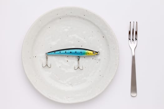 plastic fishing lure on plate