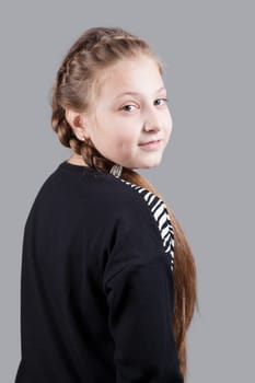 Portrait of a 10 year old girl, studio shot.