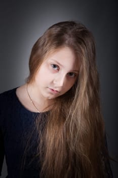 Portrait of a 10 year old girl, studio shot.