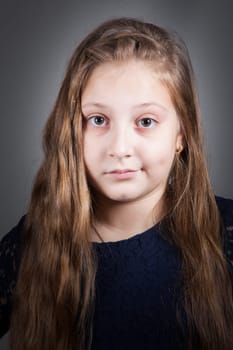 Portrait of a 10 year old girl, studio shot.