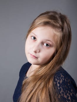 Portrait of a 10 year old girl, studio shot.