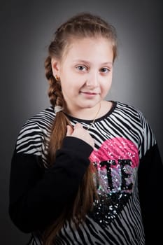 Portrait of a 10 year old girl, studio shot.