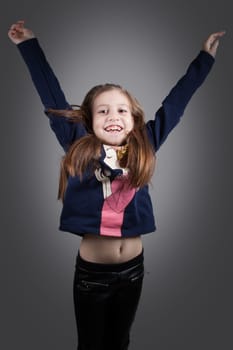 Portrait of a 8 year old girl, nicely dressed, studio shot.