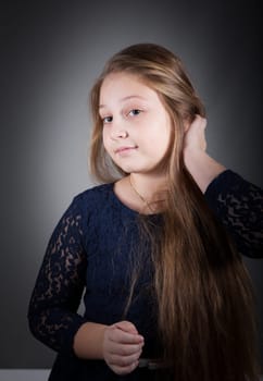 Portrait of a 10 year old girl, studio shot.