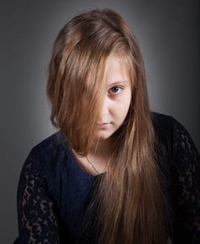 Portrait of a 10 year old girl, studio shot.