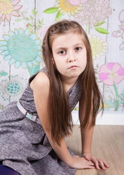 Portrait of a 8 year old girl, nicely dressed, studio shot.