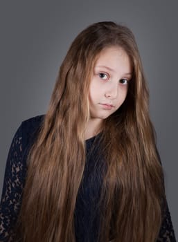 Portrait of a 10 year old girl, studio shot.