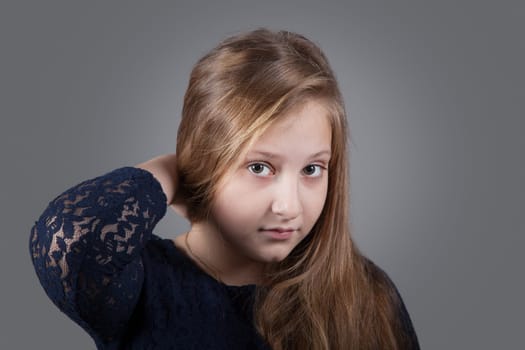 Portrait of a 10 year old girl, studio shot.