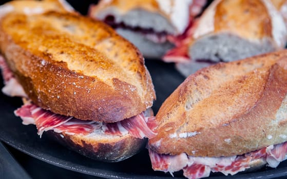 Closeup of a spanish bocadillos of cured ham or ham serrano sandwich