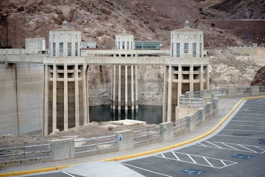 Boulder,United States - December 23,2015: Three water inlet towers of the Hoover Dam stand in a reservoir in front of rocks on December 23,2015 in Boulder.