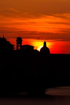 sunset over the ponte vecchio in florence,Italy
