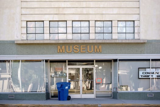 Needles,United States - December 23,2015: The entrance of the museum in Needles with a garbage can at the front door on December 23,2015 in Needles.