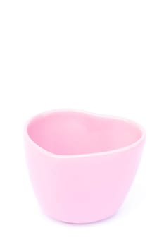 Pink ceramic bowl isolated on white background, stock photo