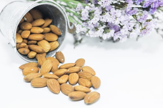 Almond grains on white clean table, stock photo