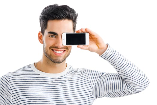 Handsome young man making a selfie picture with phone, isolated over gray background