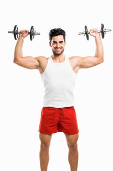 Portrait of handsome young man lifting weights, isolated on white background