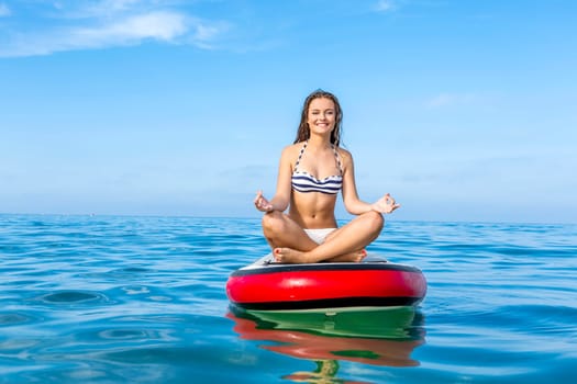 A beautiful woman practicing paddle on a beautiful sunny day