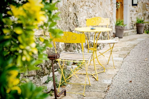 a french antique garden lounge yellow metal